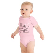 A baby wearing a one-piece onesie