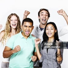 Crowd cheering enthusiastically with raised arms