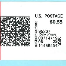 An envelope bearing a postal cancellation mark with a date