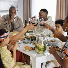 A person eating a meal at a table