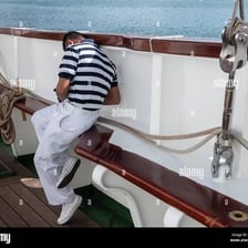 Sailors working together on the deck of a ship