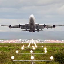 A passenger jet on an airport runway
