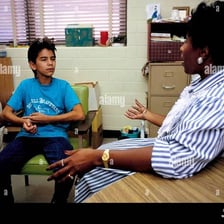 A counselor speaking with someone while offering guidance
