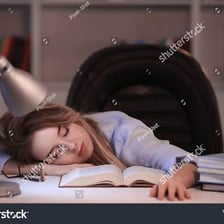 A person placing a book on a table