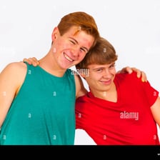 Two brothers smiling and talking together