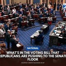 A legislature voting on a bill to make it law