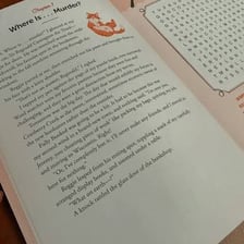 An open puzzle book showing pages devoted to solutions.