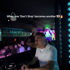 A DJ mixing multiple songs together
