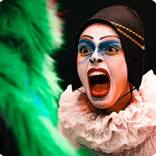 Masked performers representing commedia dell’arte characters.
