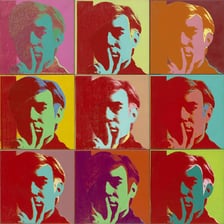 Andy Warhol shown in his studio or alongside pop-art works.
