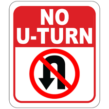 A road sign displaying a crossed-out U-turn arrow