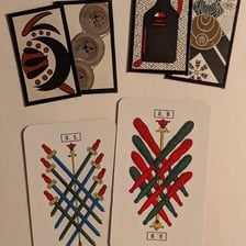A close-up of a playing card displaying its suit symbols or pips.
