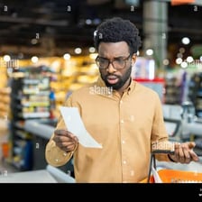 A shopper spending money with purchases and receipts