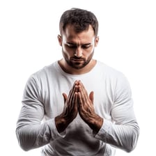 A person with clasped hands in prayer