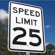 A roadside sign showing a maximum speed limit.