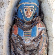 An Egyptian mummy displayed in an ancient-style tomb
