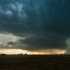 Storm clouds thinning over a landscape
