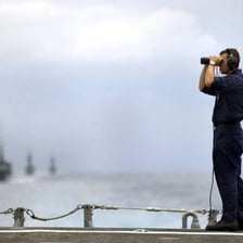 Sailor working aboard a ship.