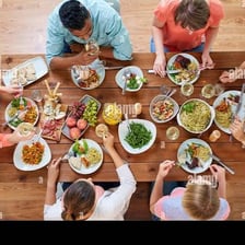 A person eating a meal at a table.
