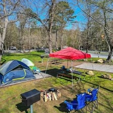 Several tents set up at a campground.
