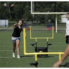 Athletes playing a game on a marked outdoor field