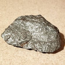 Rock containing visible metal-bearing ore