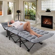 A simple folding cot set up as a temporary guest bed
