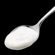 A small rounded dollop of cream on a spoon