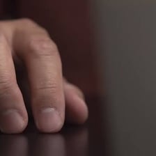 A person displaying a nervous repetitive habit.