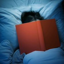 A tired person preparing to go to bed