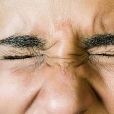 A close-up view of a person’s eye during a blink