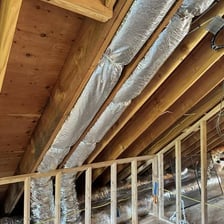 Metal ventilation ducts installed in a building ceiling