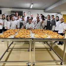 Bakers working in a pastry shop.