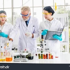 Chemist working at a laboratory bench.