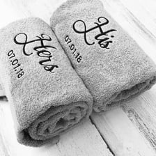 A towel embroidered with the word “HERS”