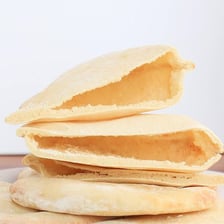 Pita breads with their interior pockets visible.