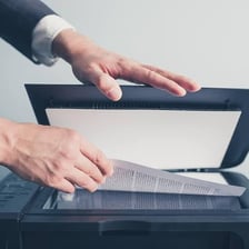 A person quickly reading over a document