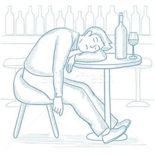 An intoxicated person seated at a bar