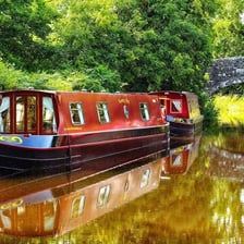 A barge moving along a canal