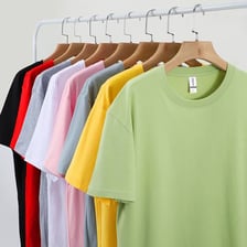 Several casual cotton T-shirts hanging on a rack.
