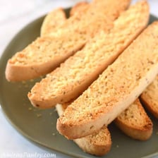 Anise seeds displayed beside biscotti.