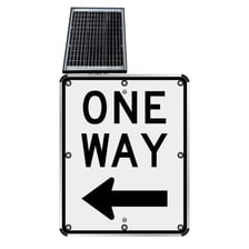 A road sign reading One Way with a directional arrow.