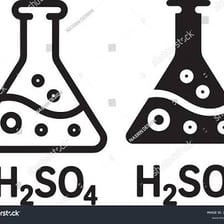 Laboratory glassware containing colored chemical liquids