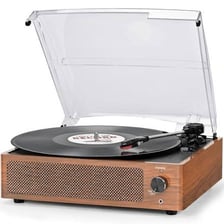 A vintage stereo system with a turntable playing a vinyl record