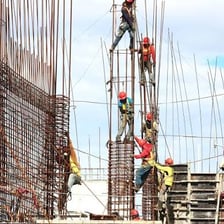 Workers putting up a structure