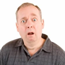 A person with a stunned, confused expression
