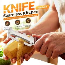 A handheld vegetable peeler removing a potato skin