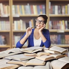 A student reading books while studying
