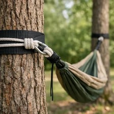 A hammock drooping downward between two trees