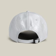 A close-up of the curved visor on a baseball cap.
